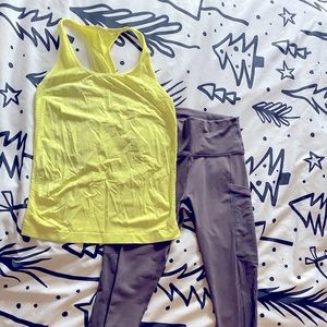 Fabletics set. High waisted capris in dark grey and seamless tank in citron.